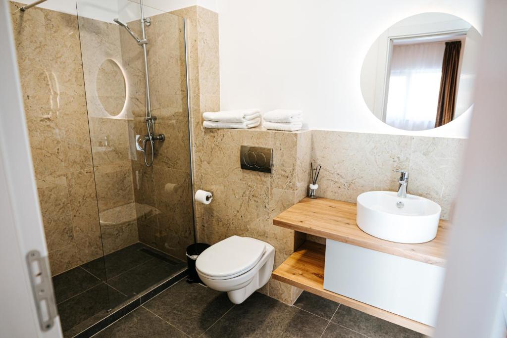 Marble-look bathroom with a walk-in shower